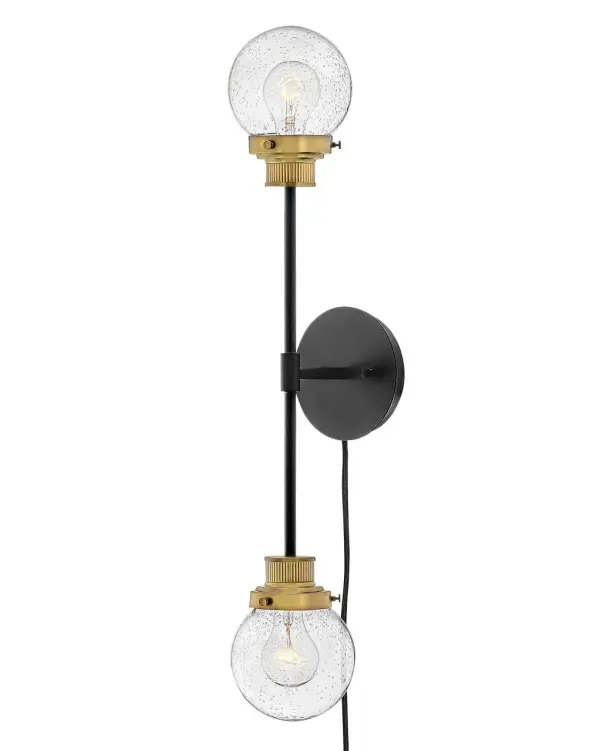 Poppy features clear seedy glass spheres that bubble out of refined, ribbed fitters to create a simple, yet sophisticated silhouette. The dual-finish combinations, Black with Brushed Nickel and Black with Heritage Brass, pair perfectly with a clean backplate or canopy and crisp crossbars to anchor this airy design. Poppy showcases mid-century style with a spectacular spin. - alternate view