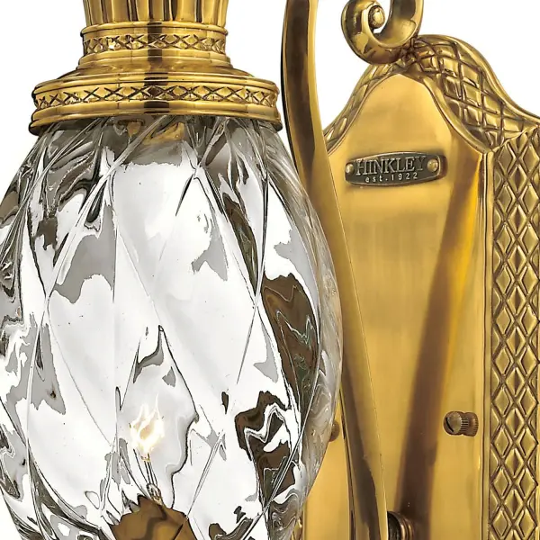 A Hinkley classic, the ornate Plantation collection features exceptional pineapple shaped, clear optic glass that makes a noble statement with matching candle sleeves and elaborate, decorative cast detailing.
