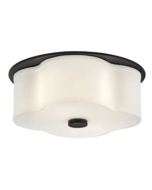The curved quatrefoil silhouette of Delaney’s off-white linen shade elegantly complements traditional aesthetics. Etched glass softly diffuses light, while an oversized decorative canopy in Heritage Brass or Black provides a subtle contrast.