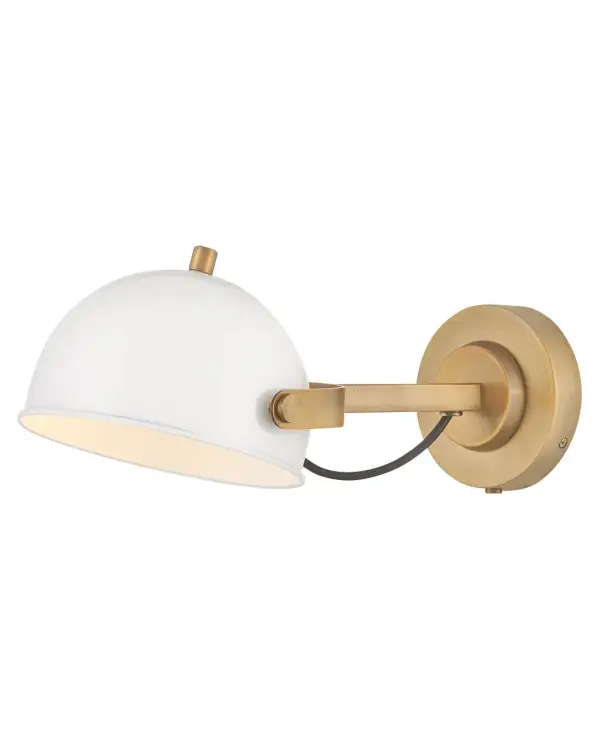 A modern bedside sconce with a vintage feel, Spence’s adjustable, rotating shade, painted white interior, and convenient on/off switch create the ideal reading or task light. Heritage Brass details and removable, black, fabric-wrapped cord complement a Black Oxide or Chalk White finish.