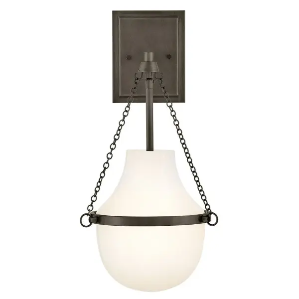 Fusing a sculpted, modern form with classically styled details, Collins features a transitional teardrop shade crafted from blown, Cased Opal glass. A central metal band and delicate chain uprights are available in Black Oxide, Heritage Brass, Heritage Bronze, or Polished Nickel finishes.