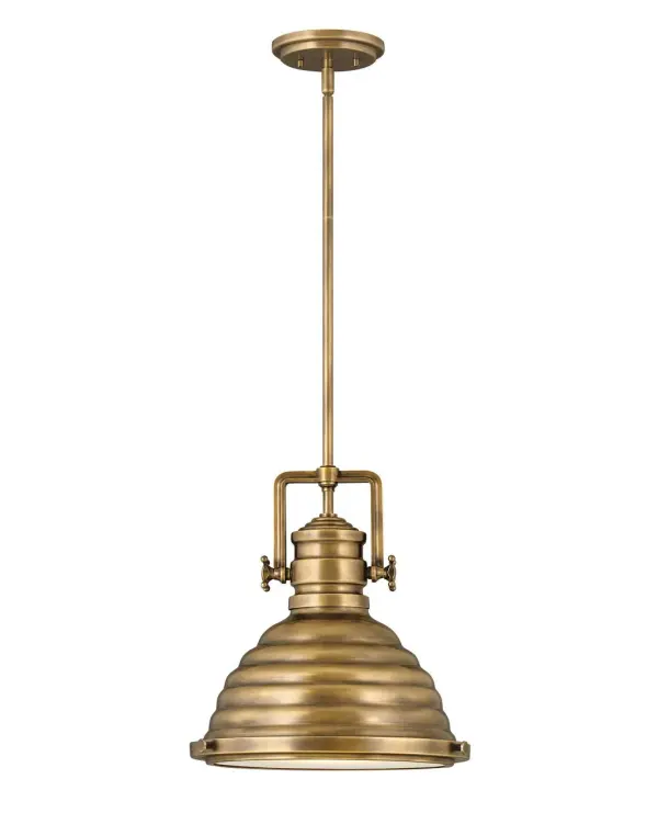 A modern interpretation of the hard-working factory pendant, Keating delivers a robust silhouette with prominent over scaled cast knobs and a boldly ribbed shade in either Heritage Brass or Heritage Brass with Aged Zinc finish options. Refined elements like the ring and knob trim detail and a flat glass lens add sophistication to this striking pendant.