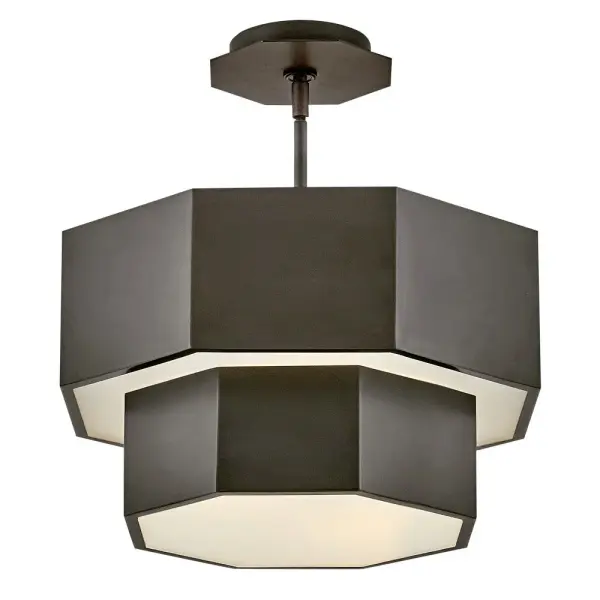 View the many sides of Facet. Interesting angles combine with bold metal features to create an edgy and contemporary profile that is unpretentious yet unforgettable. Hexagonal etched glass is showcased by Heritage Brass or Black Oxide finishes.