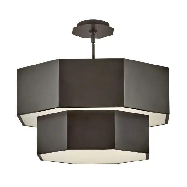 View the many sides of Facet. Interesting angles combine with bold metal features to create an edgy and contemporary profile that is unpretentious yet unforgettable. Hexagonal etched glass is showcased by Heritage Brass or Black Oxide finishes.