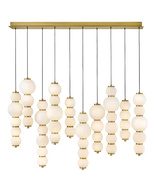 Inspired by the enduring allure of pearl jewelry, Trigo’s softly cascading silhouette makes a dramatic yet elegant statement. Glowing etched opal glass globes of varying sizes create a visual rhythm and organic flow that echo the natural imperfections and unique beauty found in genuine pearls. Differences between each globe add depth and movement, combining classic beauty with modern coastal design and offering a harmonious blend of tradition and innovation.