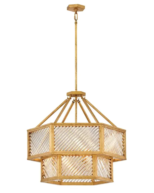 A reimagining of vintage designs from the 40s and 50s, Sura’s transitional, hexagonal Distressed Brass frame creates a glamorous yet understated and tailored appeal. Cylindrical glass rods set at alternating angles echo a soft herringbone pattern, juxtaposing geometry within geometry. Layered details create a reeded effect that is reflective and alluring.