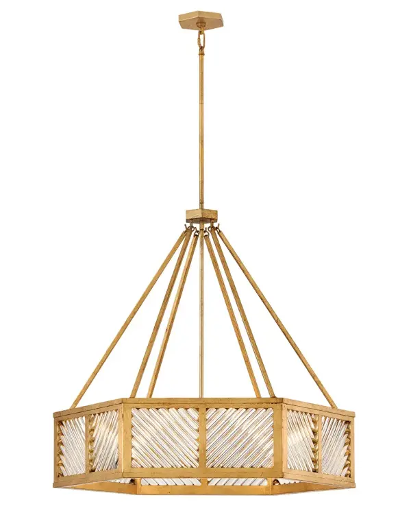 A reimagining of vintage designs from the 40s and 50s, Sura’s transitional, hexagonal Distressed Brass frame creates a glamorous yet understated and tailored appeal. Cylindrical glass rods set at alternating angles echo a soft herringbone pattern, juxtaposing geometry within geometry. Layered details create a reeded effect that is reflective and alluring.