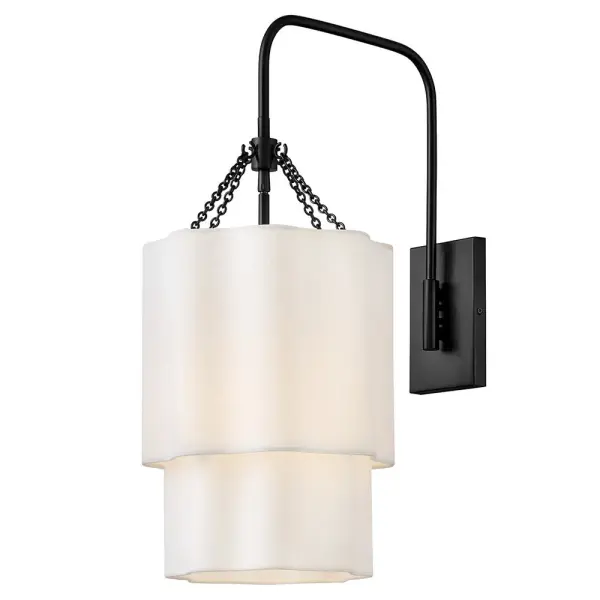Splendidly soft, Gwen’s shapely scalloped shade complements inviting light with layers of Off-White Linen suspended from delicate chains and minimal metal stems. A Black or Lacquered Brass finish provides a versatile complement to any interior style.