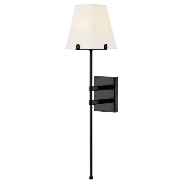 Tall and minimalist Benton’s simply chic silhouette easily complements any space or décor style. White hardback linen shades are supported by a slim stem and prongs in a Black or Lacquered Brass finish.