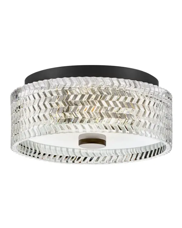 Elegant with a modern edge, Elle’s graceful design features rich chevron-cut glass that beautifully refracts light and creates a dramatic focal point within your space. The gleaming metal finish adds a hint of glam and a touch of radiance to any décor.