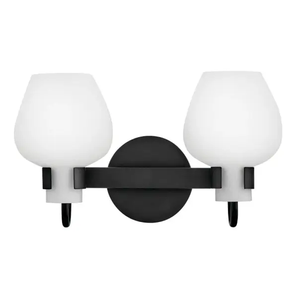 Crafted from timeless etched opal glass, Sylvie’s tulip-shaped shades provide softly diffused illumination and a touch of transitional charm. Minimalist open cuffs and simple back plates ground each fixture with a versatile Black or Heritage Brass finish.
