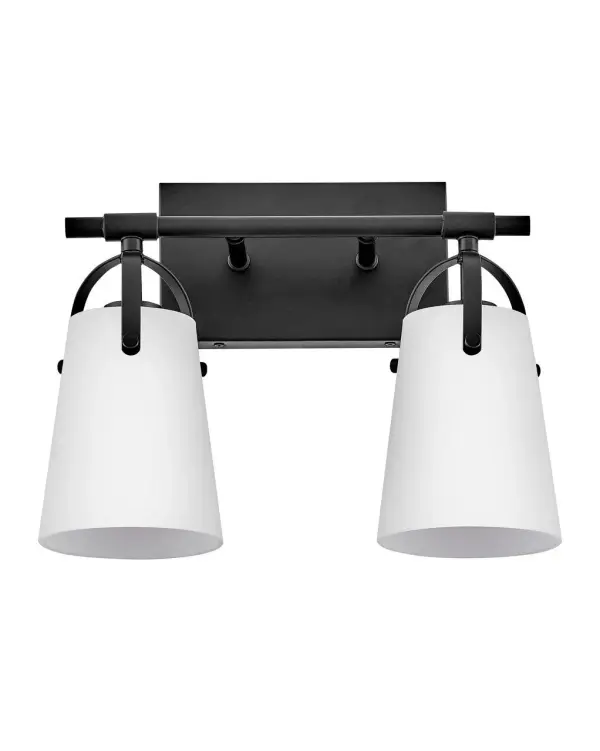 Clean and airy, Foster breathes composed simplicity into any bath space. Softly tapered glass shades suspended from arched handle prongs create a sophisticated transitional silhouette, enhanced by practical yet stylized details.