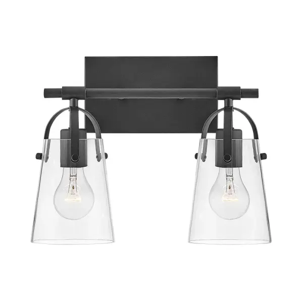 Clean and airy, Foster breathes composed simplicity into any bath space. Softly tapered glass shades suspended from arched handle prongs create a sophisticated transitional silhouette, enhanced by practical yet stylized details.