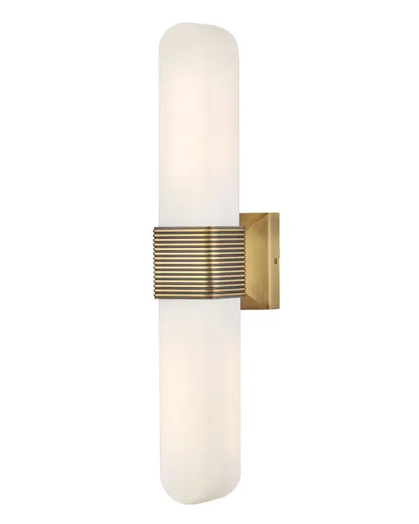 Modern with a rounded, elongated silhouette, Cotes’ Etched Opal glass is accentuated by a ribbed collar in a Lacquered Brass or Painted Black Oxide finish. The curved glass juxtaposed against square details offers a soft balance of shapes that is elegant yet versatile enough to complement any bathroom or living space.