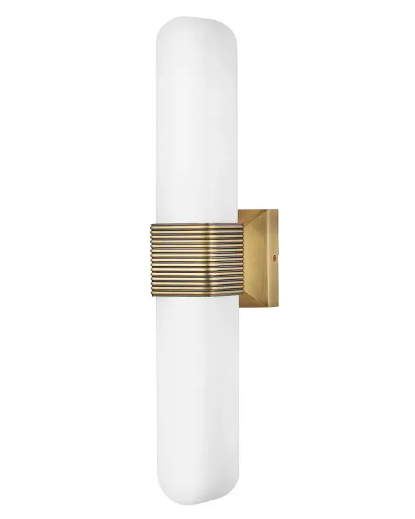 Modern with a rounded, elongated silhouette, Cotes’ Etched Opal glass is accentuated by a ribbed collar in a Lacquered Brass or Painted Black Oxide finish. The curved glass juxtaposed against square details offers a soft balance of shapes that is elegant yet versatile enough to complement any bathroom or living space. - alternate view