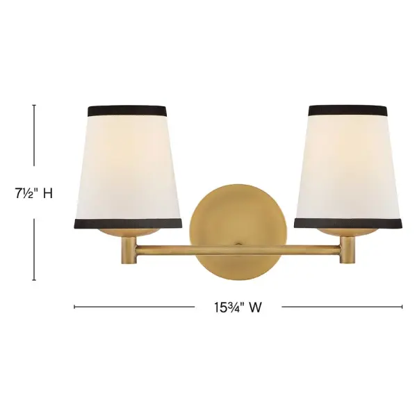 A take on traditional sconce styles, Sonia’s tapered shades feature contrasting top and bottom binding. The chic metal frame and accents are finished in versatile Lacquered Brass to complement any color palette. - alternate view