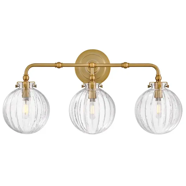 Combining vintage charm with practical design, Helene’s graceful, ribbed glass globes cast beautifully refracted light. Delicate detailing and unique knobs securing each shade are complemented by a rich Lacquered Brass finish to perfectly accentuate your space.