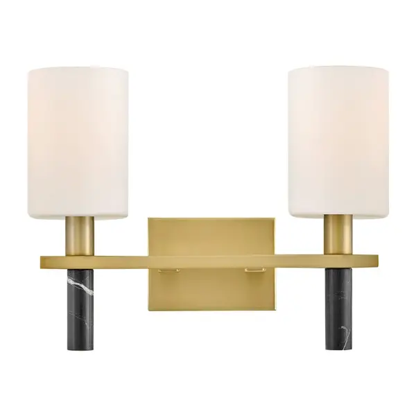 Polished with an understated silhouette, Turin is elevated by tall Etched Opal Glass and luxurious black marble stems. A minimalist backplate finished in vibrant Lacquered Brass complements the natural stone with an elegant touch of warm color.