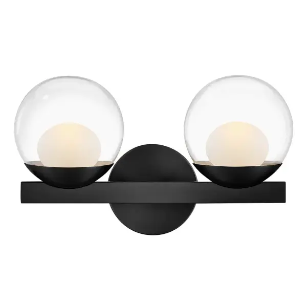 Sophisticated with an ultramodern twist, Sunni’s sleek design showcases a distinctive glass globe that artfully layers a clear glass outside with an etched white interior. A minimal backplate and frame are finished in a bold Black or luxurious Lacquered Brass finish to easily complement your space.