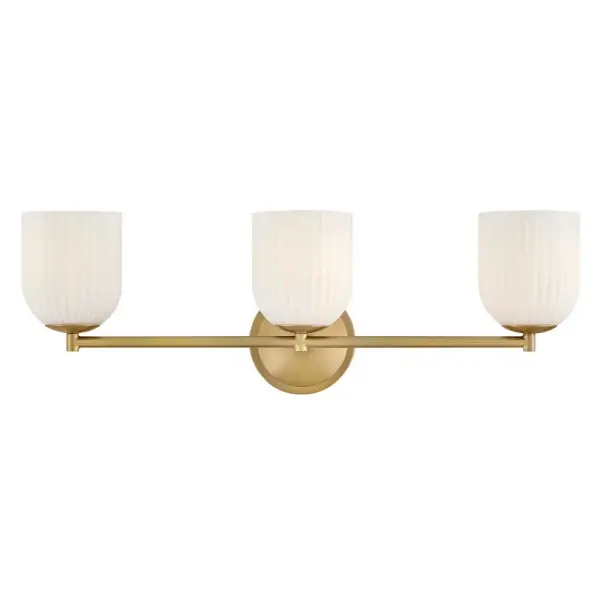 The graceful curves of Ava’s transitional ribbed glass shades are balanced by a sleek silhouette and stepped backplate. A hand-painted Lacquered Brass finish complements the Clear or Cased Opal glass with warm metallic tones, creating a timeless look that complements any décor style.
