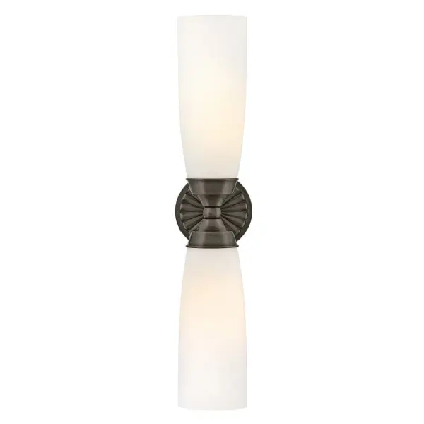 Blending the glamour of art deco design with midcentury style, Alexis showcases refined details elegantly contrasted by elongated, Etched Opal glass shades. A medallion backplate features a sunburst motif enhanced by hand-polished finishes and burnished detailing to create a rich, dimensional look that elevates any space