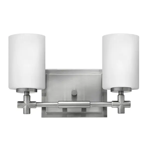 Laurel’s appealing form combines both traditional and transitional design elements. This collection is available in Polished Nickel or Brushed Nickel, and features etched opal glass shades and medium base lamping. Chic details, such as a precision die-cast cross reminiscent of a timeless faucet handle, and a cast stepped back plate, convey a lasting elegance.