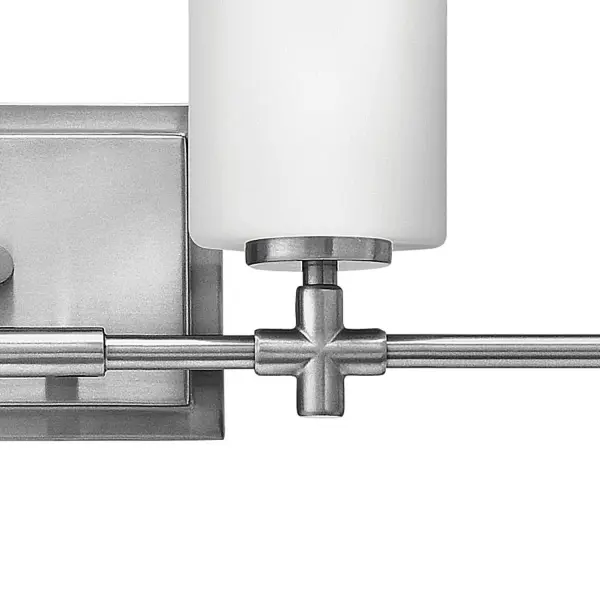 Laurel’s appealing form combines both traditional and transitional design elements. This collection is available in Polished Nickel or Brushed Nickel, and features etched opal glass shades and medium base lamping. Chic details, such as a precision die-cast cross reminiscent of a timeless faucet handle, and a cast stepped back plate, convey a lasting elegance.