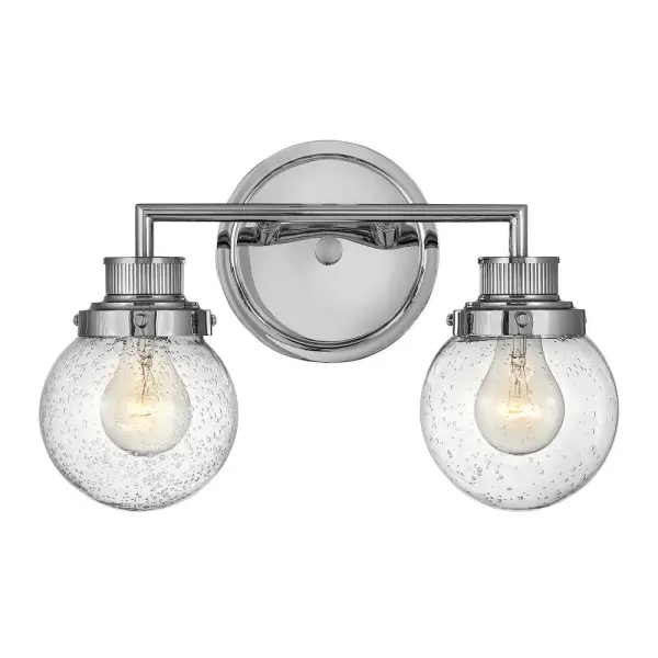 Poppy features clear glass spheres that bubble out of the refined, ribbed Chrome or Heritage Brass fitters to create a simple, yet sophisticated silhouette. An elegant, stepped backplate and crisp crossbar anchor this airy design. Poppy showcases mid-century style with a spectacular spin.