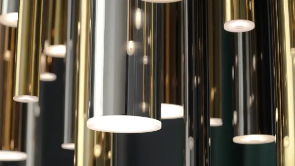 The Flute Linear Pendant transforms any space with 31 elongated metal tubes in mixed metallic finishes. Integrated LED modules provide 8,330 lumens of warm light while additional ceiling spots highlight the high-gloss finishes. - alternate view
