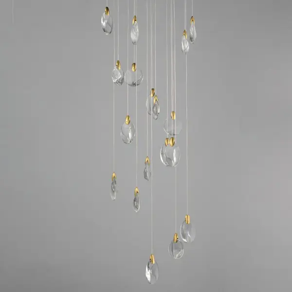 The Pebble collection brings nature-inspired elegance with irregularly shaped crystal pebbles suspended from polished gold clasps. Concealed LED lighting creates an iridescent shimmer while the matte black canopy provides additional downlight. - alternate view