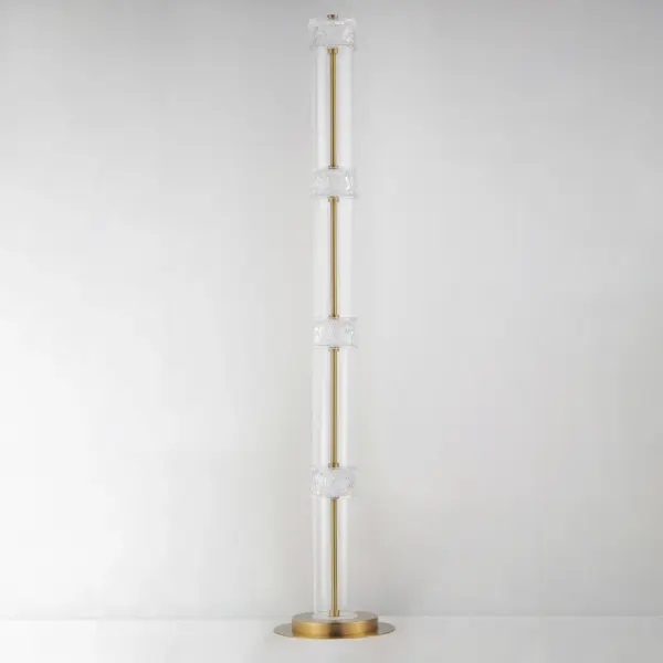 The Elysian floor lamp showcases a stunning vertical composition of clear glass cylinders separated by rippled crystal fonts on a refined Natural Aged Brass frame. Integrated LED backlighting creates an airy, luminous effect. - alternate view