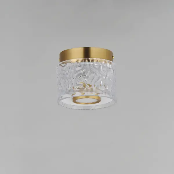 The Elysian flush mount combines clear glass cylinders with rippled crystal accents on a refined brass frame. Integrated LED lighting creates an airy, luminous effect perfect for intimate spaces requiring elegant ambient light. - alternate view