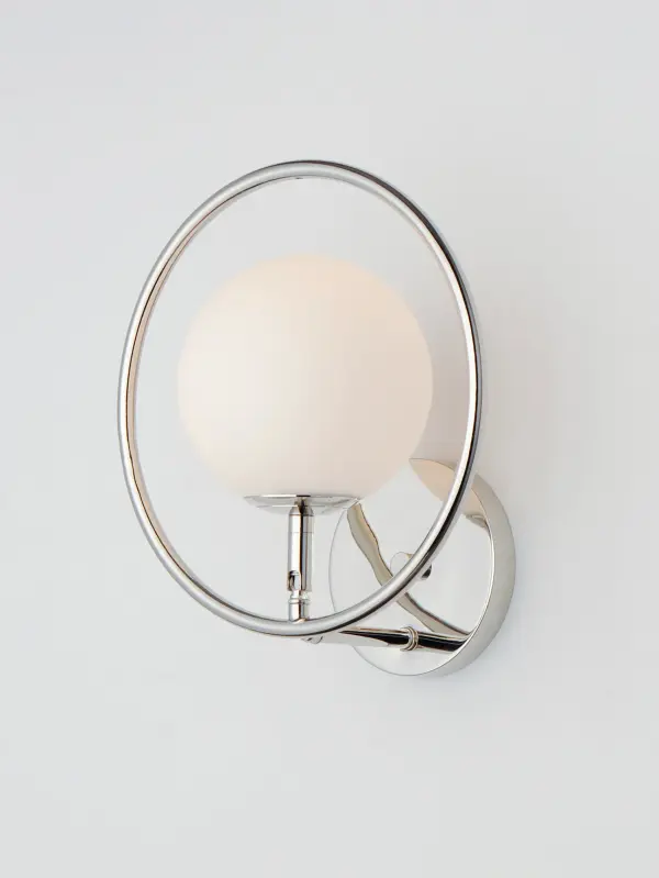 The Revolution Bath Sconce combines polished nickel hoops with satin white glass globes for a clean, contemporary look that works beautifully in both modern and transitional spaces. Perfect for vanity lighting. - alternate view