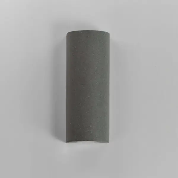 The Pilar outdoor wall sconce combines industrial concrete construction with efficient LED technology. Its cast concrete body withstands harsh weather and coastal environments while dual LED boards deliver 1200 lumens of warm light. - alternate view