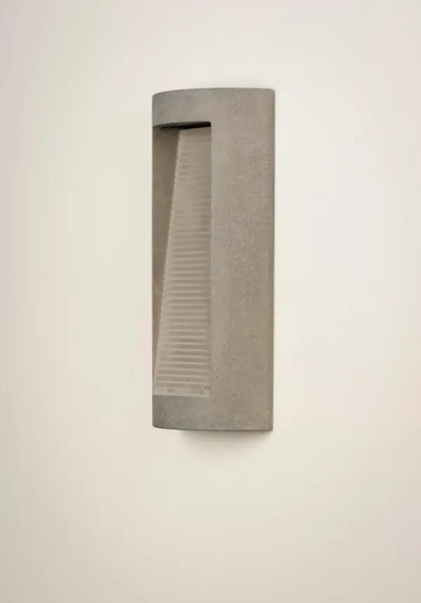 The Boardwalk wall sconce combines industrial concrete construction with efficient LED technology, making it ideal for harsh coastal environments. Its contemporary aesthetic and maintenance-free operation suit modern outdoor spaces. - alternate view