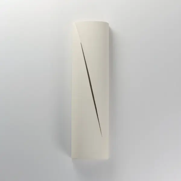 The Puff outdoor wall sconce combines architectural concrete construction with sophisticated lighting design. Its softly rounded form and diagonal light reveal create ambient illumination while making a bold design statement. - alternate view