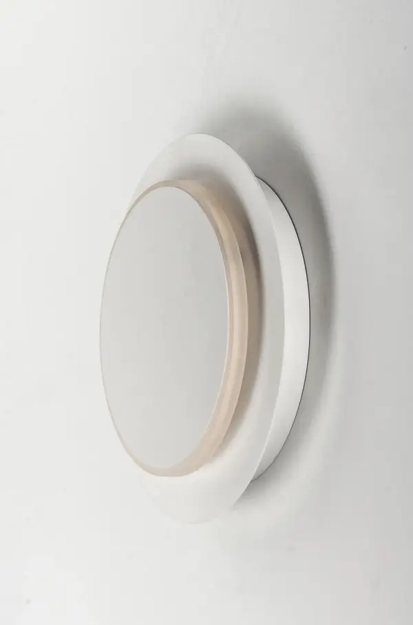 The Revolver LED Bath Vanity features an innovative rotating design that creates a striking halo effect on walls. Its edge-lit construction and clean matte white finish deliver modern sophistication for contemporary bathrooms. - alternate view