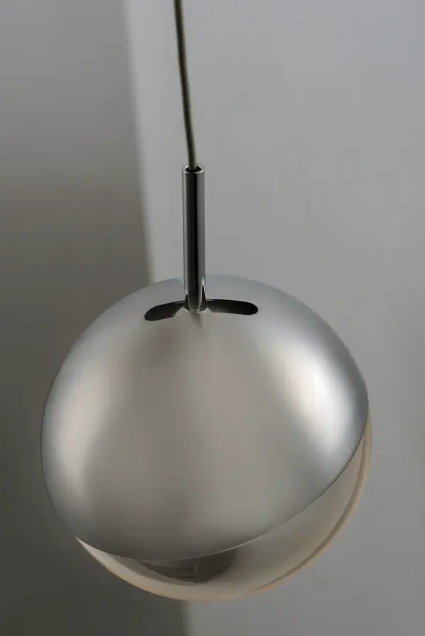 The Spot pendant combines polished chrome with clear acrylic spheres featuring innovative edge-lit LED technology. Adjustable slotted tops allow you to aim light where needed, making it both functional and stylish for contemporary spaces. - alternate view