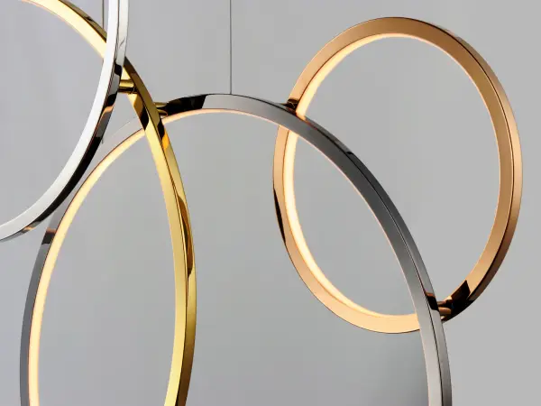 A large-scale architectural pendant featuring intersecting rings in multiple high-end finishes. Perfect for filling grand spaces with artistic presence, this versatile fixture can be configured vertically or horizontally. - alternate view