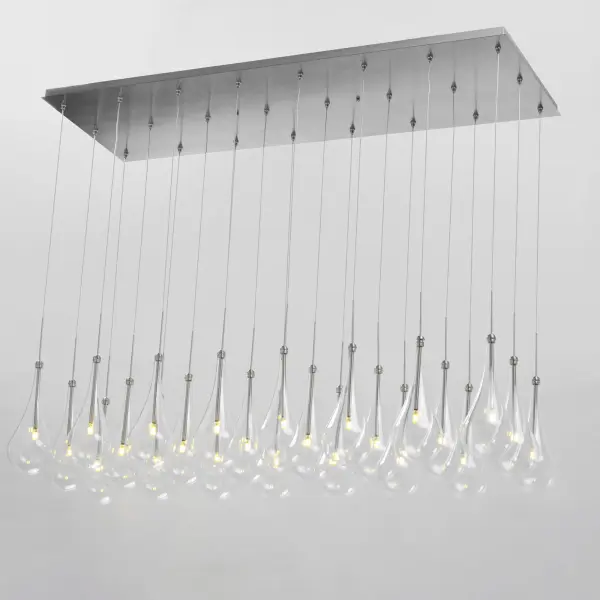 The Larmes LED Linear Pendant makes a dramatic statement with 24 individual clear glass shades suspended in a sleek linear arrangement. Energy-efficient LED technology delivers warm 3000K light across an extended profile, perfect for illuminating large dining tables and kitchen islands with contemporary elegance. - alternate view