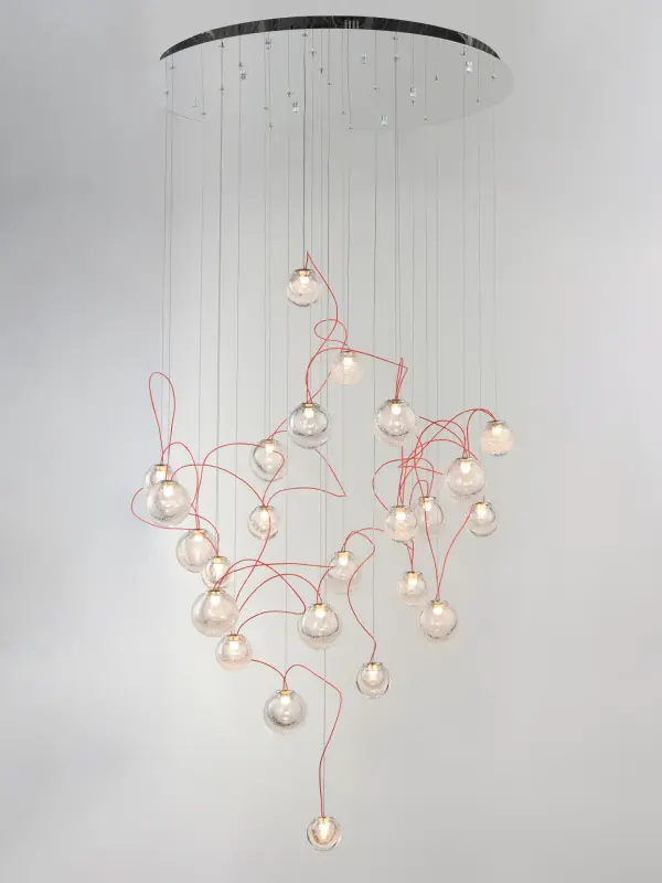 The Bobble pendant transforms lighting into art with 24 bubble glass spheres suspended on contrasting red cords. Its avant-garde design creates a galaxy-like effect, perfect for dramatic spaces needing a bold focal point. - alternate view