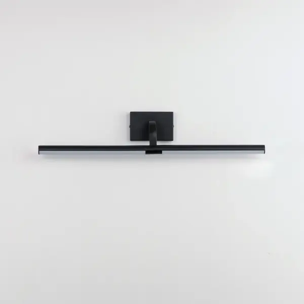The Mona wall sconce combines functionality with contemporary design, featuring a rotating tubular LED frame that directs light precisely where needed. Perfect for illuminating artwork, mirrors, or as vanity lighting. - alternate view