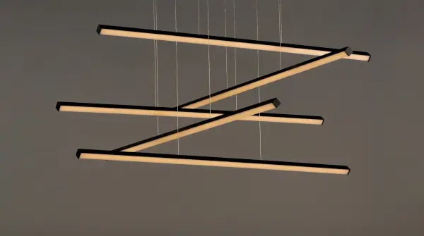 The Hover pendant features minimalist aluminum batons with V-shaped acrylic diffusers that create a wider light distribution. Its modular design allows for creative arrangements, making it a unique sculptural statement piece. - alternate view