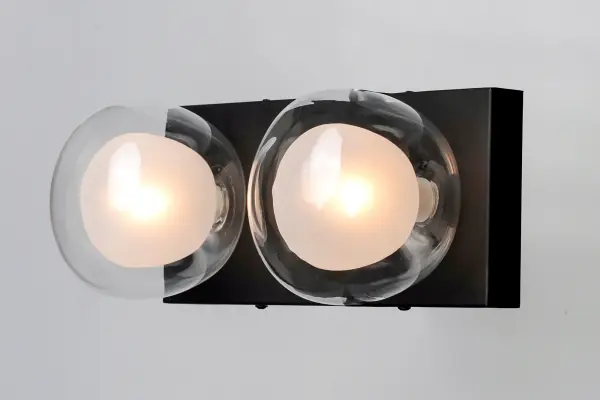 The Pod Bath Vanity combines contemporary design with functional lighting through its unique branching structure. Clear and frost glass globes create layered illumination while black and gold finishes add sophistication. - alternate view