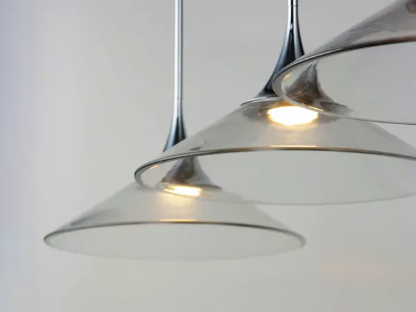 The Cono pendant delivers crisp, modern illumination through crystal clear acrylic cones and polished chrome stems. Its integrated LED design provides energy-efficient lighting with a clean aesthetic perfect for contemporary spaces. - alternate view