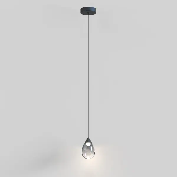 The Dewdrop Mini Pendant features a teardrop-shaped blown glass shade with mirror smoked finish that beautifully diffuses integrated LED light. Its compact size and cord suspension make it ideal for task lighting or clustered installations. - alternate view