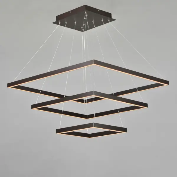 The Quad 3-Tier LED Pendant transforms lighting into kinetic art with suspended aluminum squares in warm Bronze finish. High-powered dimmable LEDs deliver 7000 lumens while adjustable connectors allow multiple configurations. - alternate view