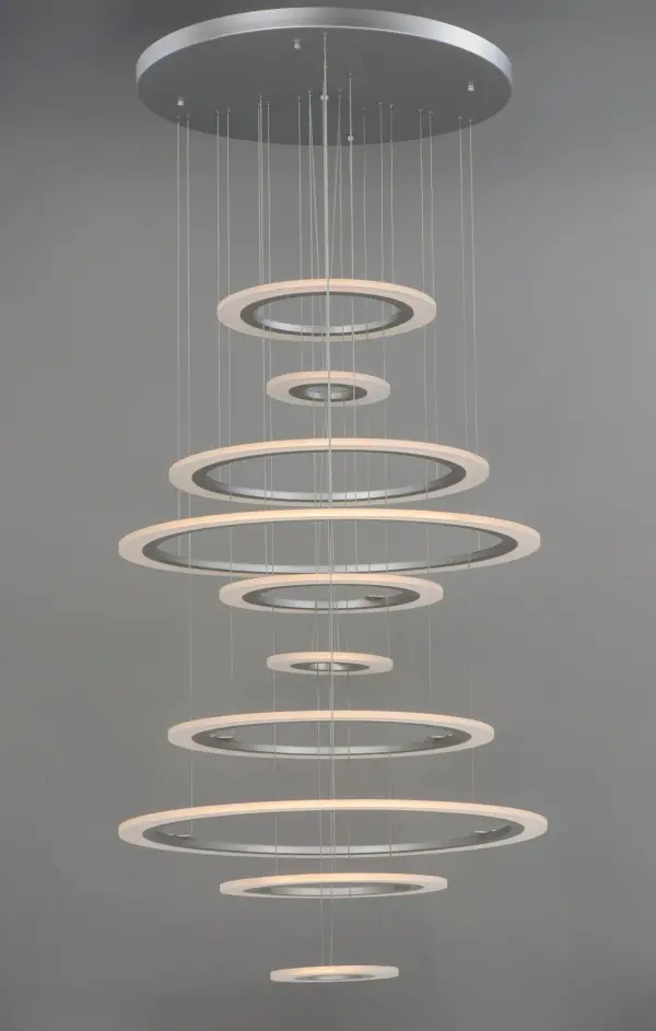 The Saturn II LED pendant makes a bold statement with its geometric metal rings and glowing acrylic diffusers. Perfect for large-scale residential and commercial spaces requiring dramatic illumination and modern design. - alternate view