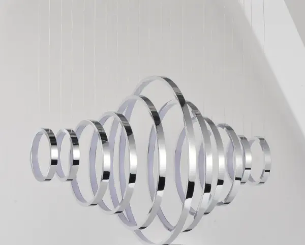The Hoops LED Linear Pendant features multiple polished chrome hoops with integrated LED strips that create an indirect, ambient glow. Its contemporary design and configurable arrangement make it a striking focal point for modern spaces. - alternate view