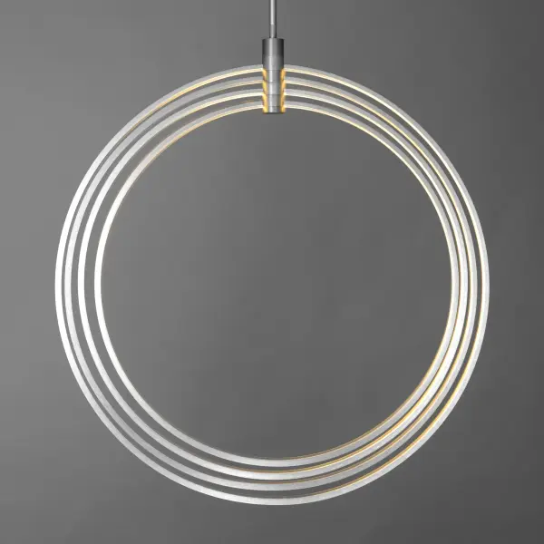 The Concentric LED pendant features four orbital rings creating a unique spherical design. Internal LED strips provide both direct and indirect lighting with 3675 lumens, making it a functional statement piece for modern interiors. - alternate view